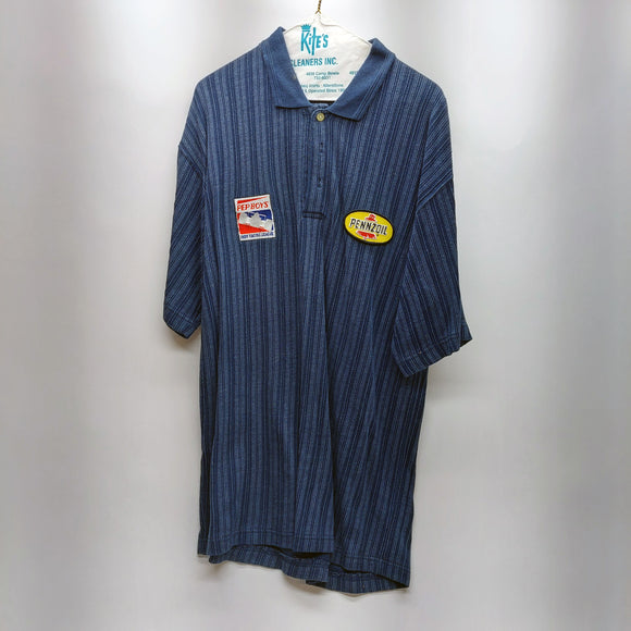 Johnny Rutherford's Pep Boys Pennzoil blue polo shirt. Size large. From the Private Collection of Johnny Rutherford.