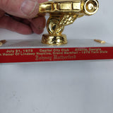 Johnny Rutherford's in honor of Lindsey Hopkins Grand Marshal Trophy Award. Presented by the Capital City Club in 1978 .